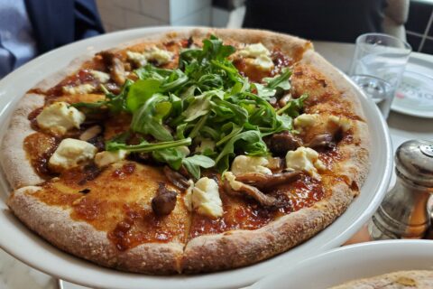 A plate with full-sized pizza in East Brunswick, NJ